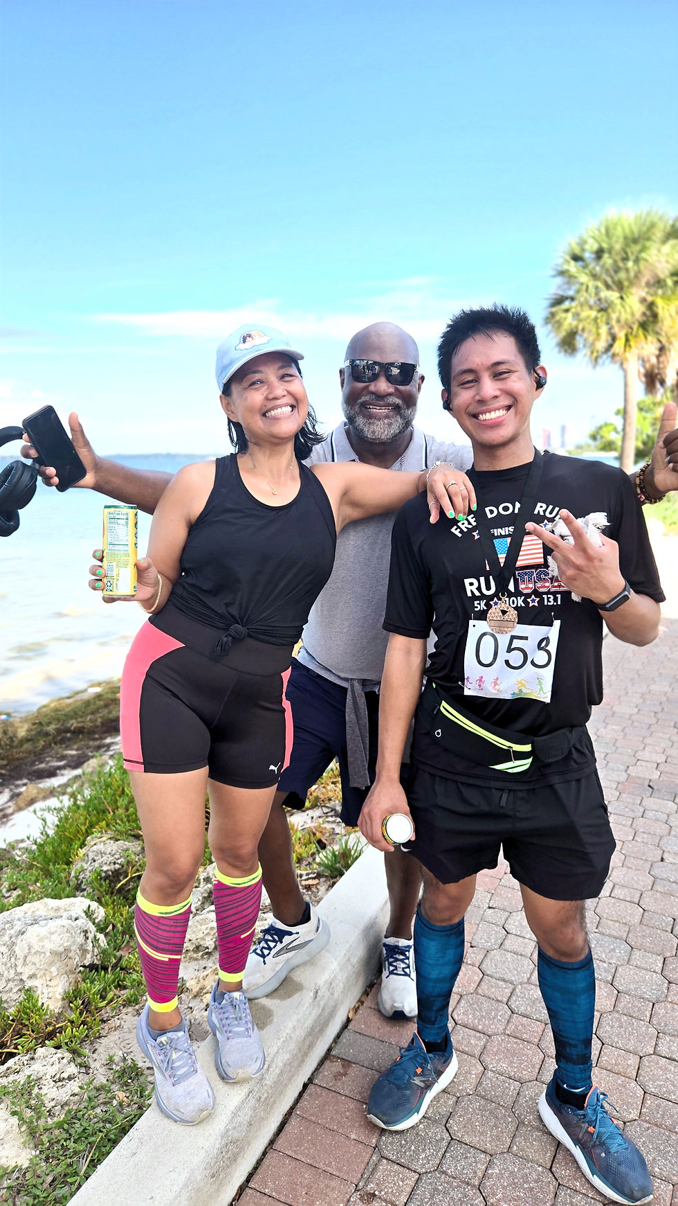 Celebrating victory together: proud family moment as my son shows off his well-earned medal after the race.