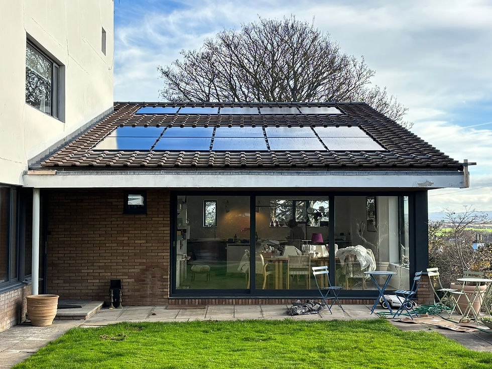 The remodelled lower wing, with new full-width glazed doors to the spacious dining kitchen