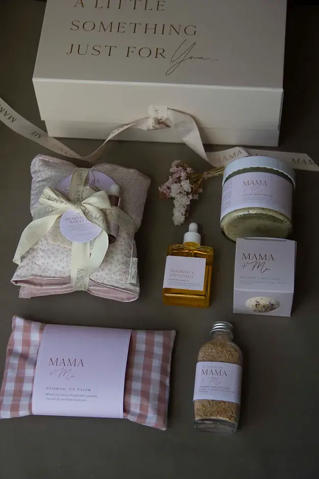 Contents in the pregnancy selfcare hamper box. Belly oil, wheat bag, eye pillow, soaks, bump scrub