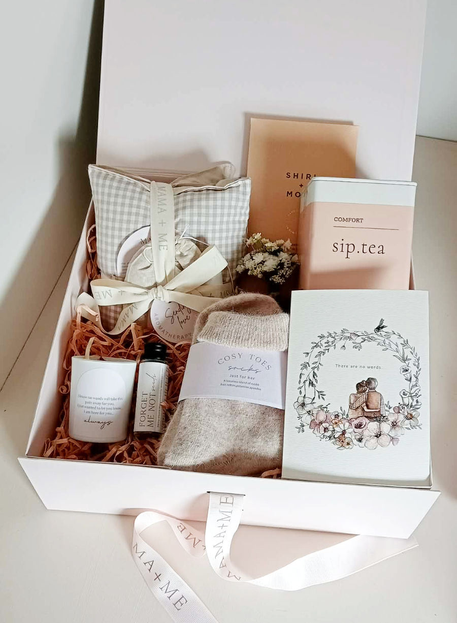 Grief gift box with curated products to support someone through the loss of a loved one.