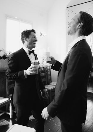 Documentary wedding and family photography across Sydney and NSW Gay Marriage, 2 groomsmen laughing at reception