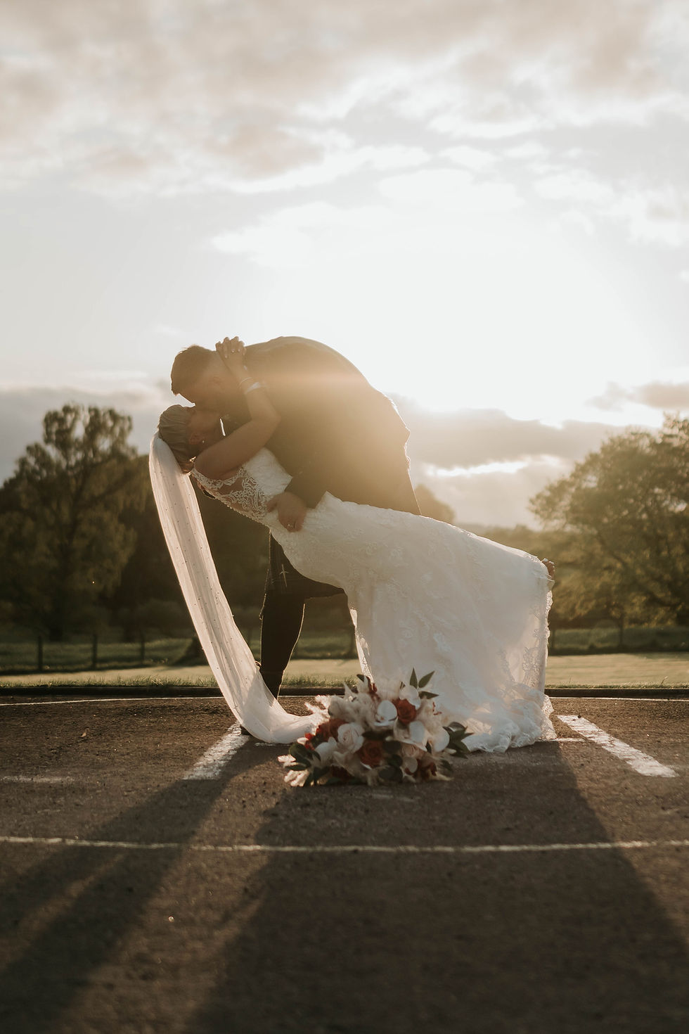 Bride and groom kissing at a Cornhill Castle Wedding sunset.