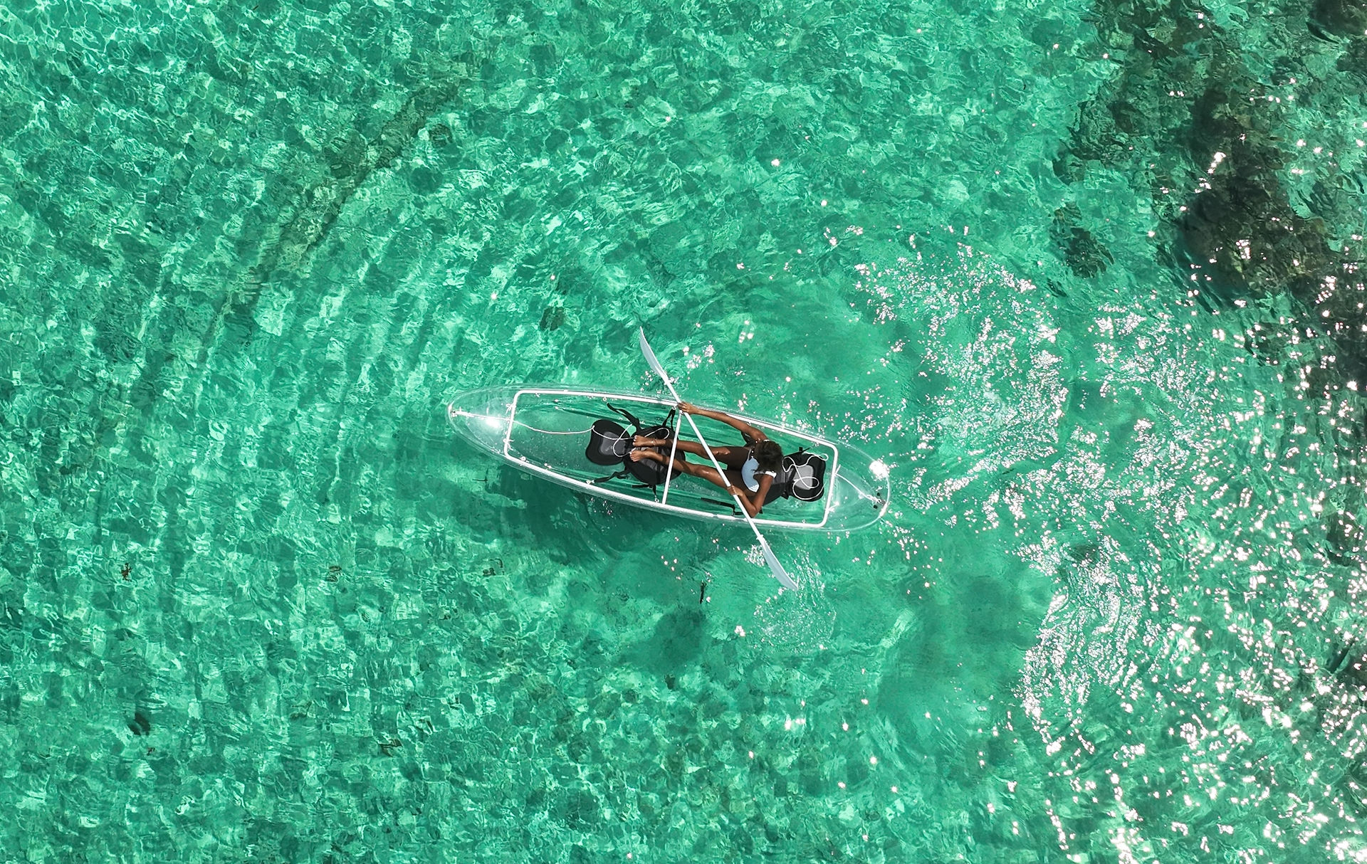 Paddleboarding adventures in the calm, turquoise waters of San Blas from your catamaran