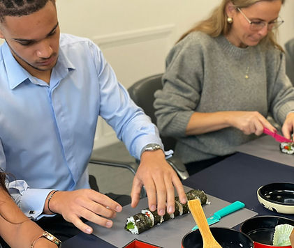 Staff at MUFG in London enjoying a lunchtime express maki sushi making event