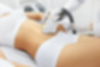 Cosmetology. Closeup Of Beautician Doing Laser Epilation Treatment On Beautiful Female Bod