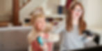Mother and Daughter playing video game.