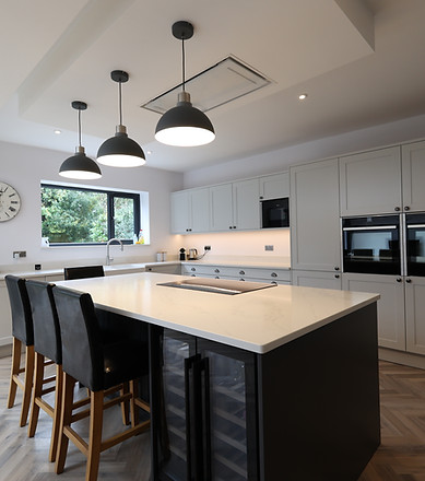Modern kitchen with island and hanging lights