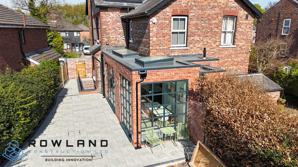 brickwork extension with floor to ceiling glass windows