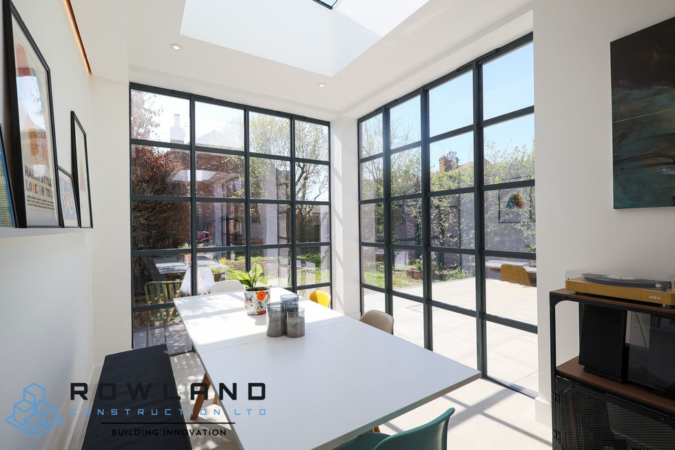 a dining room with a table and chairs