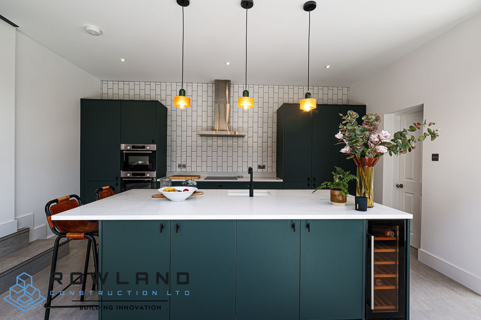 a kitchen with green cabinets