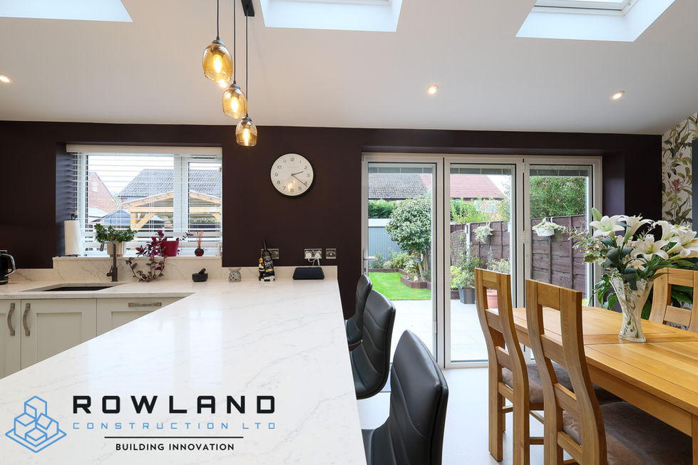 Single-story rear extension with open-plan layout, new brickwork, and bifold doors to maximise light and living space.