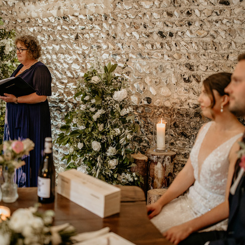 Bride and Groom with their Celebrant for the wedding ceremony in the East Barn.