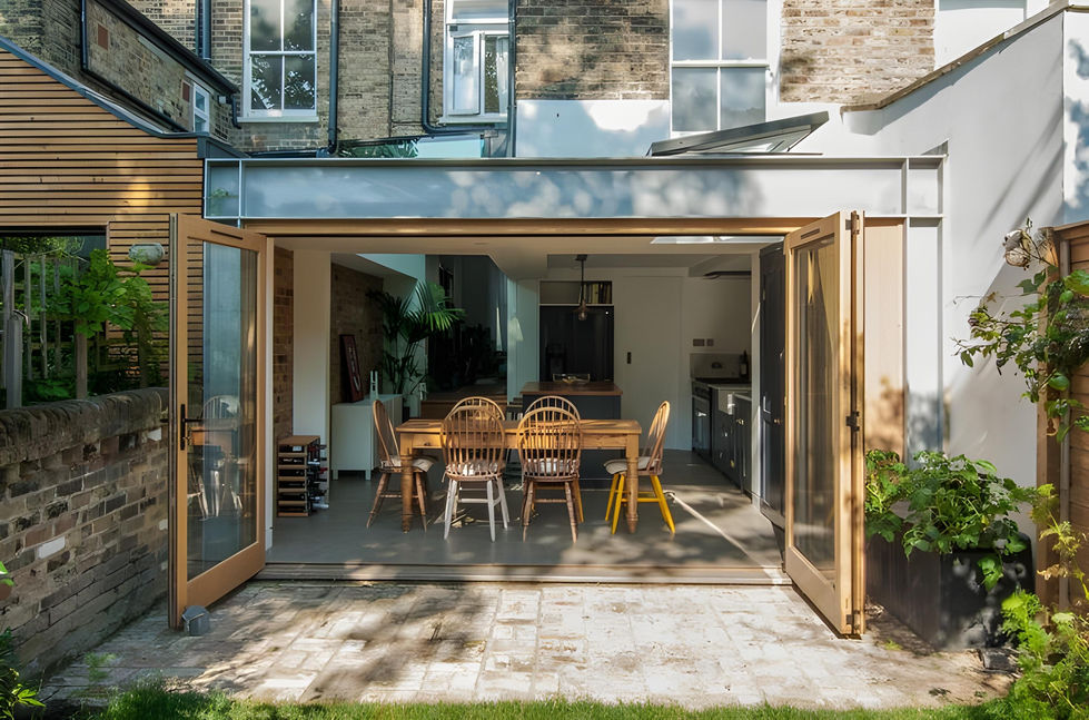Attached ADU conversion in Orange County featuring wide wooden bi-fold doors, open dining area, and indoor-outdoor flow—maximizing livable space with expert craftsmanship by Local Construction.