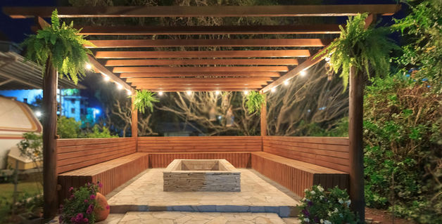 merbau timber seating with tile fire pit and paved floor