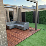 merbau deck, artificial grass with artificial garden wall and metal decorative panel feature wall