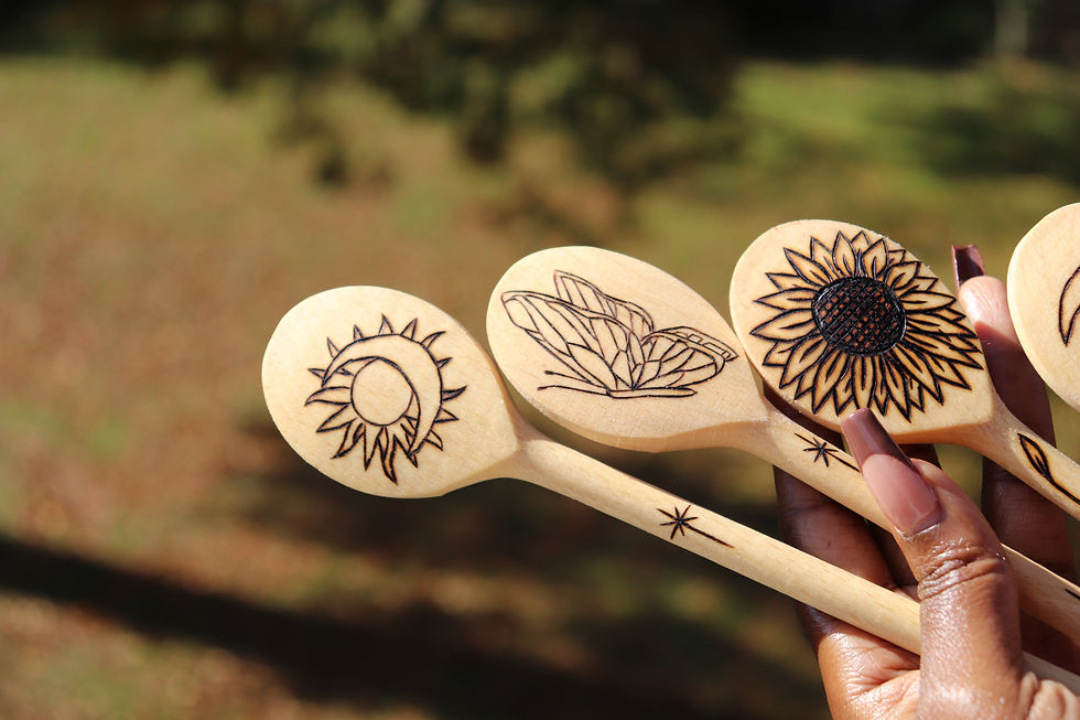 Thumbnail: Three wooden spoons with sun, moon, butterfly, and sunflower designs