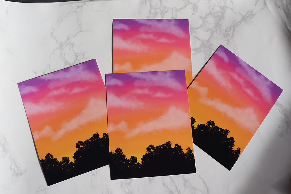 Four sunset prints: pink, orange, purple hues over silhouetted trees