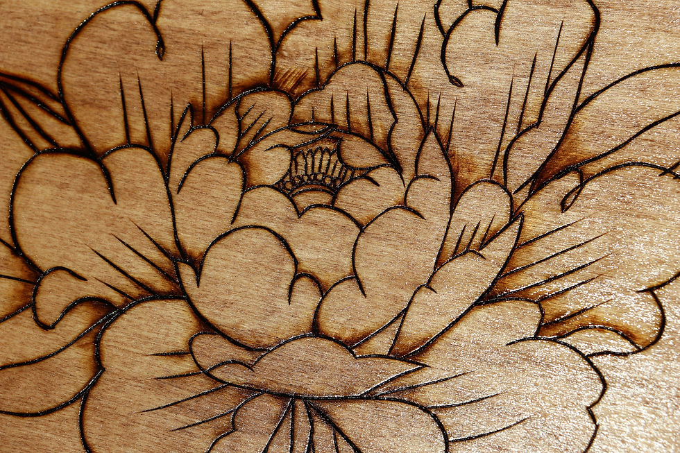 Thumbnail: Intricate wood-burned peony design