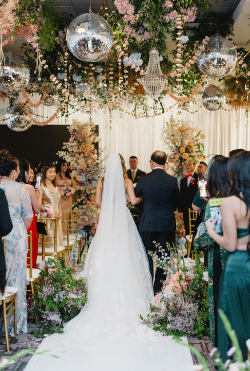 bride walking down ceremony aisle