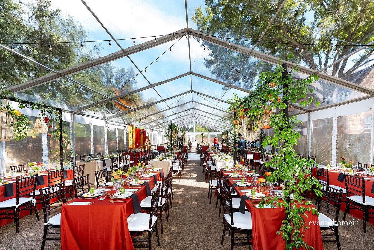 Vibrant, colorful outdoor tented event in the fall time