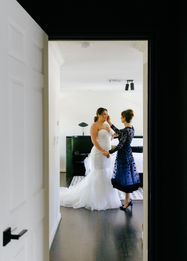 bride getting ready with her mom