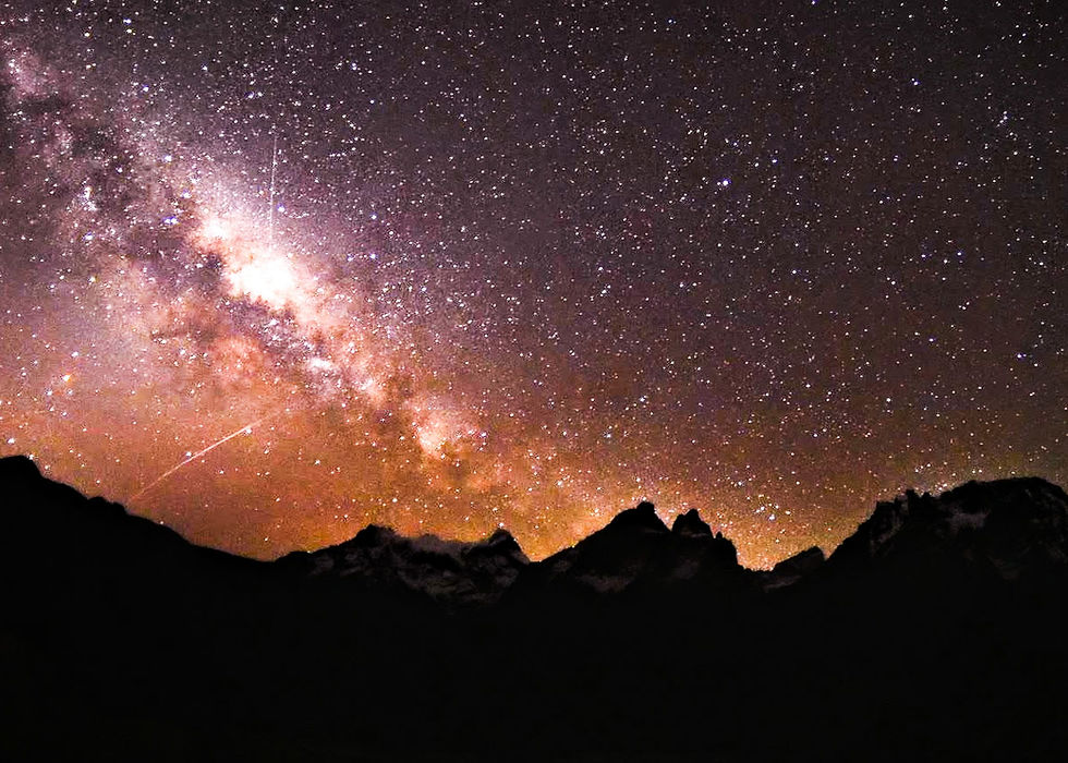 A stunning image of the Milky Way galaxy stretching across the night sky above the iconic Torres del Paine in Patagonia, a celestial masterpiece of stars and cosmic wonder.