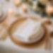 timeless elegant wedding table setting with a textured gauze table runner, metallic charge
