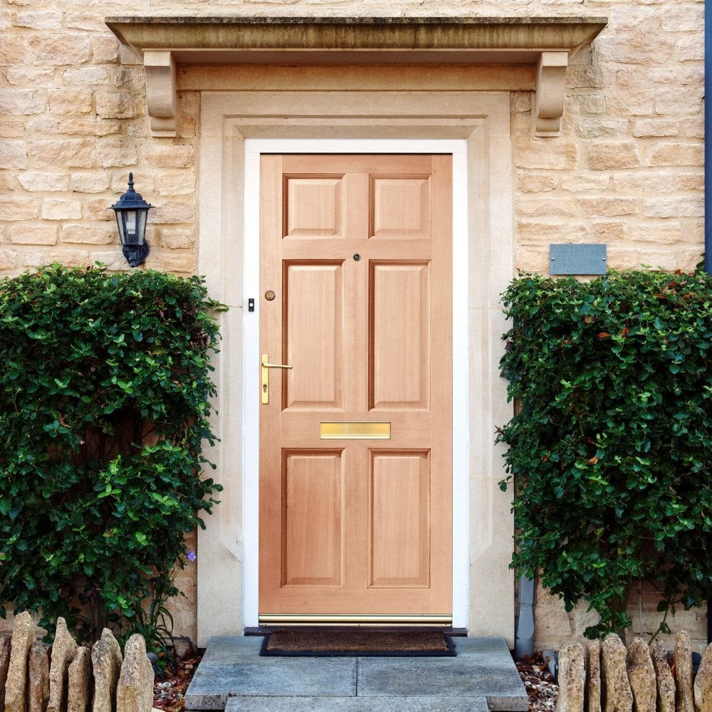 Six-panel wooden front door with brass hardware