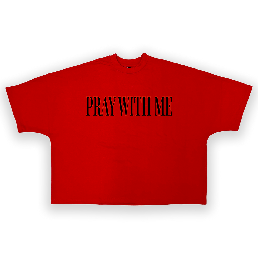 red oversized t-shirt. black letters that say "pray with me"