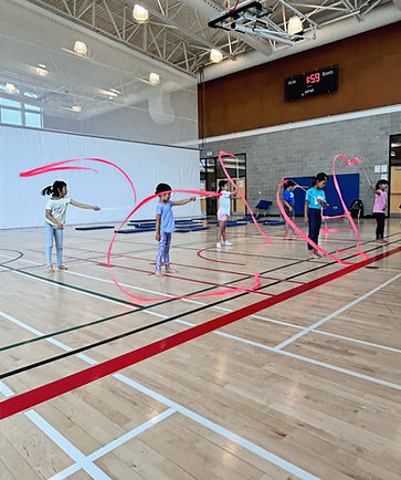 Kids doing exercise with ribbon