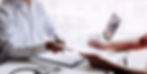 A doctor reviewing patient history