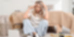 A stressed woman with perimenopause on the floor