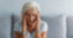 A woman suffering a migraine