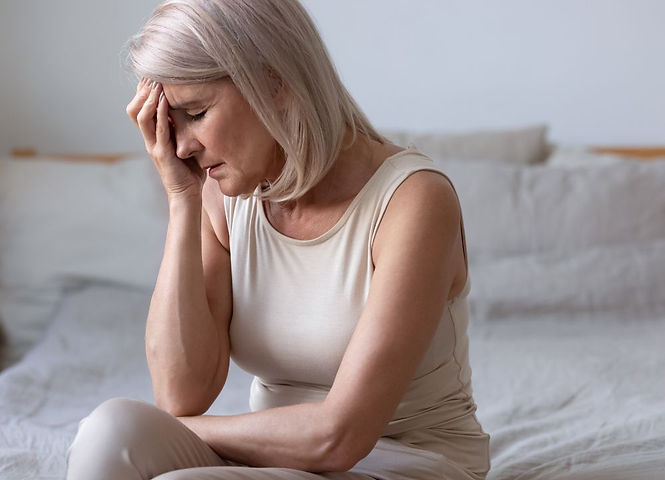 A woman with menopause feeling stressed