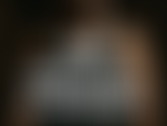 A confident man standing tall in gym lighting, with bold overlay text: “From Undervalued to Unshakable.” Symbolizes inner strength and self-worth.