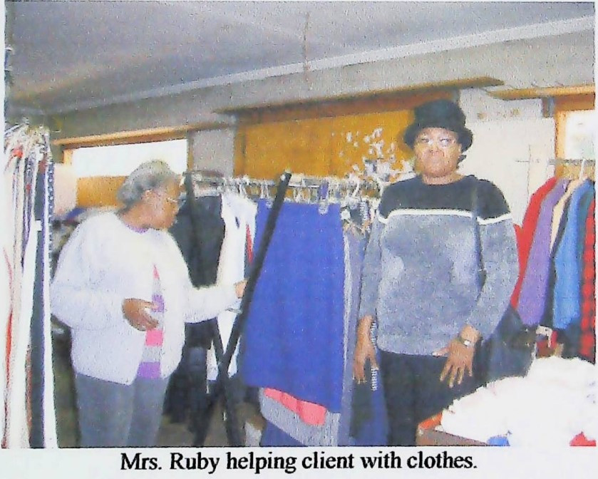 Mrs. Ruby Helping Clients with Clothes.jpg