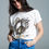 Thumbnail: Short Sleeve T-Shirt With Graphic Peace Sign Design at the Front in Cream