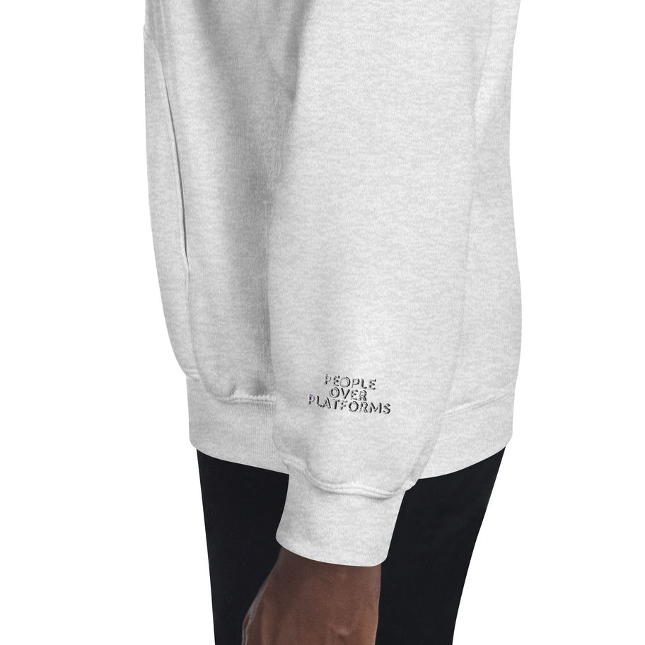 Grey hoodie sleeve with visible text: people over platforms. Close up