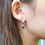 Thumbnail: Decorous double heart blue sapphire cz drop earrings