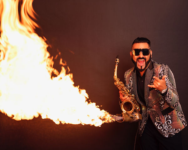 Sax player blows flames out of sax