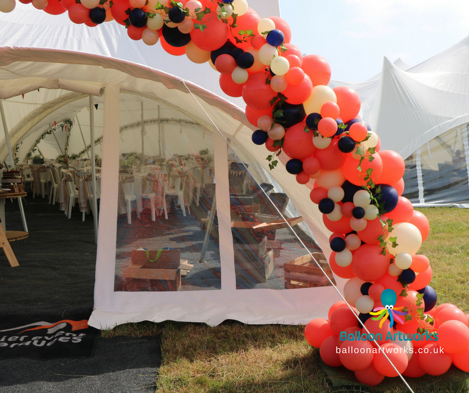 Coral balloon arch with navy and ivory balloons Derby Derbyshire