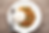 White plate with rice and stir-fried minced meat with herbs. Fork and spoon on the side. Wooden table background.