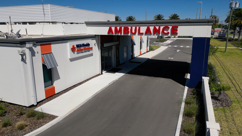 Aerial drone shot looking towards the ambulance wing of the HCA Oviedo Alafaya Emergency Room.