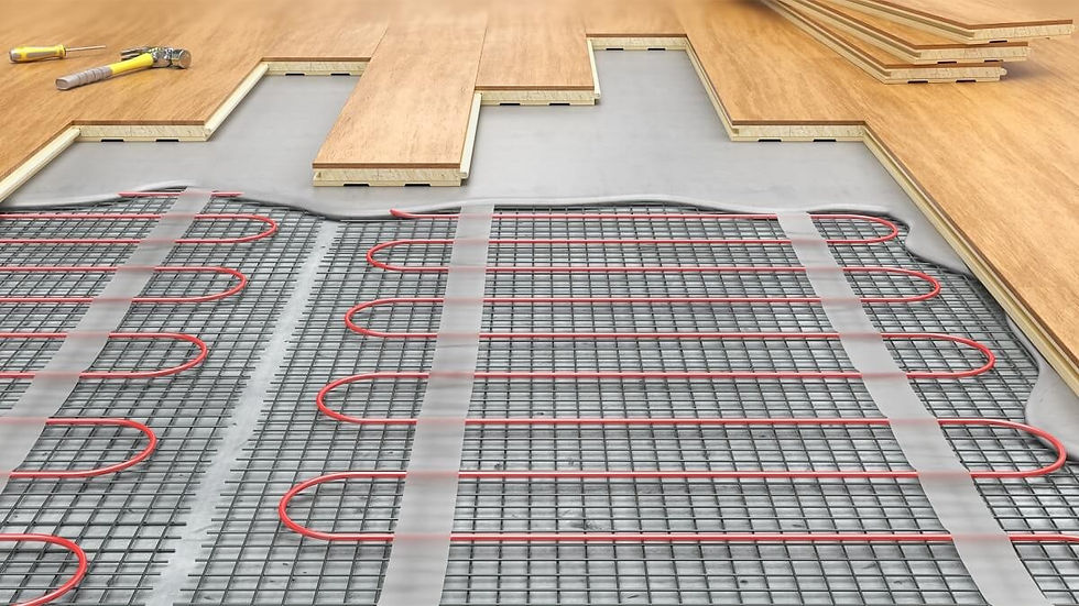 Close-up of an electric dry underfloor heating system being installed under engineered wood flooring. The image shows red heating cables fixed to metal mesh beneath floating wooden floorboards during a modern residential flooring renovation project. Ideal for content related to underfloor heating installation, energy-efficient home heating, engineered wood flooring, and London home renovations.