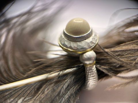 Crafted from sterling silver 925 and 18K gold, set with a fossilised mammoth bone 