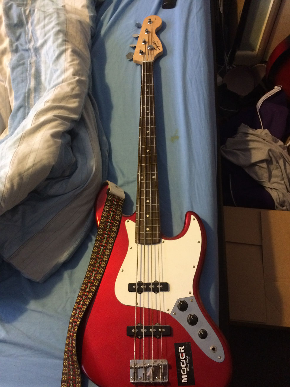A Fender Squier Jazz bass.