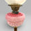 Thumbnail: Antique Victorian Cranberry Etched Glass Oil Lamp With Brass Column