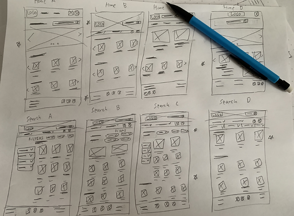 Paper wireframes of the homepage for the Moe's responsive website and the search results page.