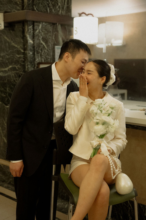 a couple laughing at their City Hall Manhattan Wedding