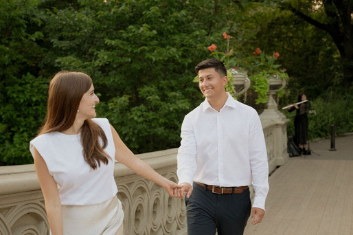 engagement photography nyc captures a couple walking in central park